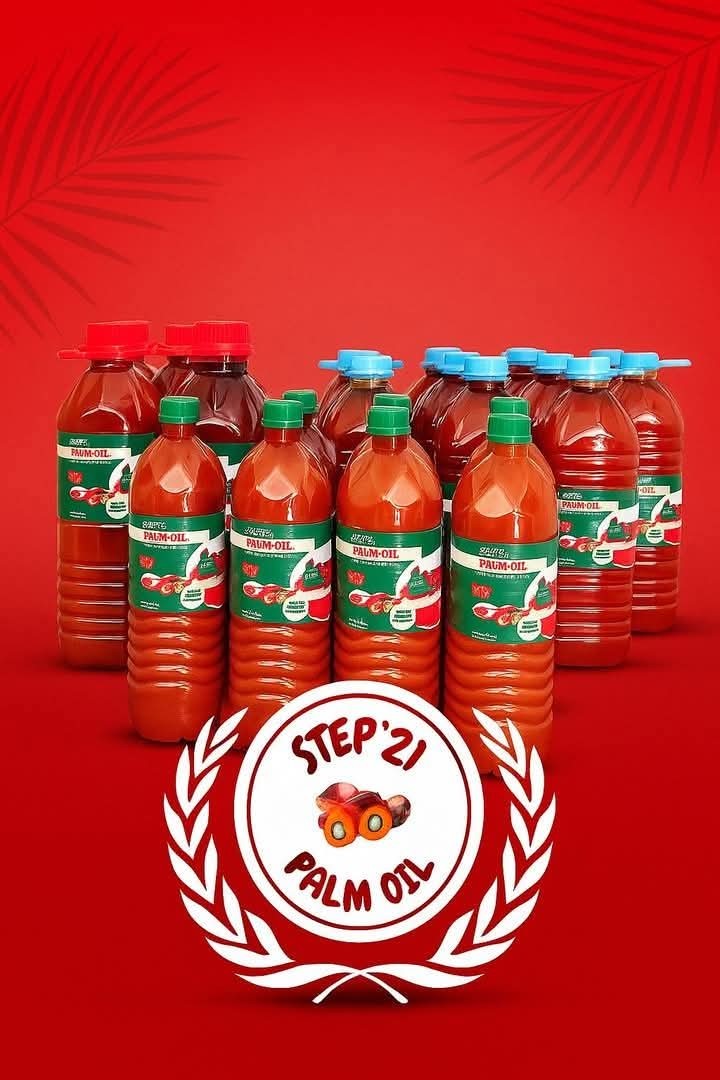 Fresh red palm oil being bottled at the mill